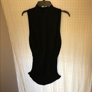 Black sleeveless ruched turtle neck tunic
